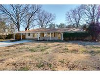 Ranch style home with mature trees and a spacious yard at 2833 Alan Sw Dr, Marietta, GA 30064