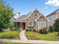 Charming craftsman style home with stone exterior and landscaped yard at 431 Serenity Ln, Woodstock, GA 30188