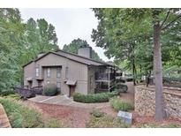 Attractive exterior of a multi-unit building nestled in a wooded setting at 2510 Cumberland Se Ct, Smyrna, GA 30080