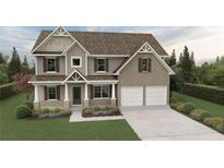 Two-story house with a two-car garage, landscaping, and a light brown exterior at 1431 Stephens View Dr, Loganville, GA 30052