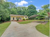 Ranch home with carport and landscaped yard at 170 Pinehurst Dr, Stockbridge, GA 30281