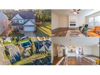 Two-story house with brick and siding, two-car garage, and landscaping at 214 Walnut Ridge Rd, Canton, GA 30115