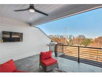 Outdoor rooftop terrace with furniture, BBQ, and city skyline views at 337 Pine Ne St # B, Atlanta, GA 30308