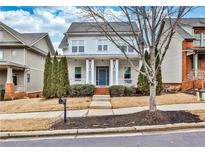 Two-story house with white siding, blue door, and a porch at 3749 Baxley Ridge Dr, Suwanee, GA 30024