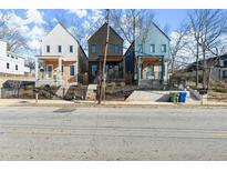 Three modern townhouses with unique siding colors and fenced yards at 988 Mcdaniel Sw St, Atlanta, GA 30310