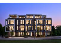 Modern multi-unit building with lighted windows at dusk at 105 Georgia Se Ave # 2, Atlanta, GA 30312