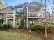 Two-story townhome with private balcony and landscaped yard at 501 Country Park Se Dr, Smyrna, GA 30080