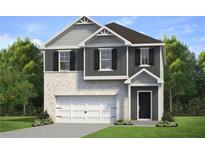 Two-story home with gray siding, white garage door, and landscaping at 17 Camellia Dr, Fairburn, GA 30213