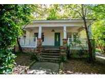 Charming white house with stone accents and a welcoming front porch at 99 Moreland Se Ave, Atlanta, GA 30316