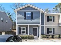 Two-story townhome with gray siding, black shutters, and a small front yard at 2137 Chadwick Road, Atlanta, GA 30331