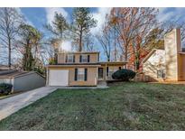 Two-story house with attached garage and landscaped yard at 2089 Glenwood Downs Dr, Decatur, GA 30035