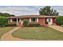 Ranch style brick home with landscaped yard and attached garage at 363 Nebo Rd, Dallas, GA 30157