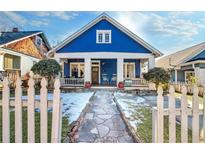 Charming blue house with white trim, stone pathway, and picket fence at 836 Dill Sw Ave, Atlanta, GA 30310