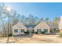 Charming single-story home with stucco exterior, green shutters, and beautifully landscaped front yard at 3639 Fowler Rdg, Douglasville, GA 30135