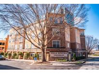 Villa Sonoma Condominium building, featuring brick and stone accents, and ample parking at 10 Perimeter Summit Ne Blvd # 4315, Brookhaven, GA 30319