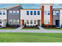 Three-unit townhome development showcasing modern design and landscaping at 1641 Winpost Nw Ln, Atlanta, GA 30318