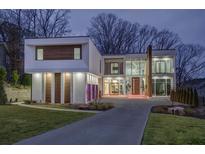 Modern two-story home with a sleek design and landscaped lawn at 55 Serendipity Way, Atlanta, GA 30350