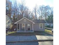 Gray bungalow house with front porch and small yard at 754 North Ave, Atlanta, GA 30354