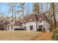 All-brick home with a charming French-style roof at 8120 Tynecastle Dr, Atlanta, GA 30350