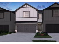 Charming two-story home with a two-car garage and landscaped front yard at 2113 Avalon Rdg, Conyers, GA 30013