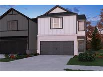 New construction two-story home featuring neutral paint, a two-car garage, and a landscaped yard at 2125 Avalon Rdg, Conyers, GA 30013