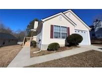 Charming single-Gathering home with a one-car garage, neutral siding, and well-maintained landscaping at 1475 Waterton Trl, Douglasville, GA 30134