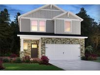 Two-story home with stone accents and a two-car garage at 2030 Avalon Rdg, Conyers, GA 30013
