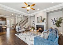 Spacious living room featuring a fireplace and hardwood floors at 3499 Village Park Nw Way # 6, Kennesaw, GA 30144