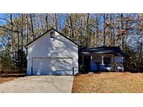 Charming one-story house with attached garage and wooded backdrop at 2865 Preston Dr, Rex, GA 30273