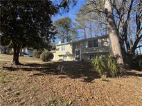 Ranch style home with mature trees and landscaping at 2101 Scarbrough Dr, Stone Mountain, GA 30088