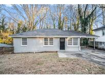 Charming ranch home with gray brick exterior and carport at 2224 Polar Rock Sw Ave, Atlanta, GA 30315