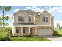 Two-story house with brick and siding, featuring a two-car garage and front porch at 131 Bennett Farm Dr, Loganville, GA 30052