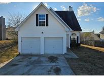 Two-car garage and neat front yard at 2718 High Tide Dr, South Fulton, GA 30349