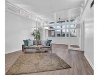 Bright living room with large windows and hardwood floors at 346 Carpenter Dr # 51, Atlanta, GA 30328