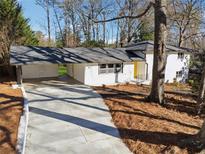 Ranch style home with carport, and newly landscaped yard at 3048 Charlbury Pl, Avondale Estates, GA 30002