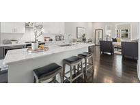 Modern kitchen with island, stainless steel appliances, and white cabinetry at 456 Parkway Ne Dr # 12, Atlanta, GA 30308