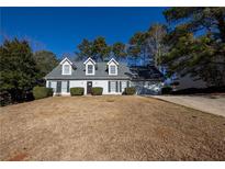 Charming two-story house with a spacious yard and attached garage at 3354 Garden Mill Ter, Ellenwood, GA 30294