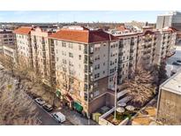 Aerial view of a modern apartment building with red tile roofs at 230 E Ponce De Leon Ave # 317, Decatur, GA 30030