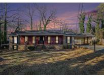 Ranch style home with carport and mature landscaping at 5546 Stoneybrook Ct, Mableton, GA 30126