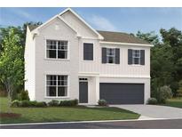 Charming two-story home showcases a light brick exterior, a two-car garage, and inviting curb appeal at 7289 Eton Ln, Locust Grove, GA 30248