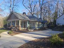 Charming craftsman bungalow with a welcoming front porch and landscaped yard at 3463 Lee St, Smyrna, GA 30080