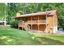 Ranch style home with large deck and wooded lot at 3454 Hill Ln, Acworth, GA 30102