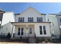 Charming two-story home with inviting front porch and modern farmhouse design at 146 Birch Tree Way, Cumming, GA 30040