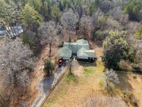 Ranch home on wooded lot with long driveway at 4625 Gaydon Rd, Powder Springs, GA 30127