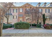 Brick front exterior of townhome with landscaping and walkway at 4429 Wilkerson Manor Se Dr, Smyrna, GA 30080