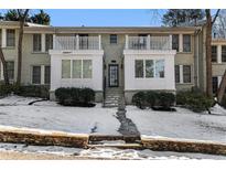 Brick front of charming two-story home with snowy landscaping at 1879 Johnson Ne Rd # 5, Atlanta, GA 30306