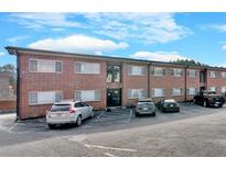 Brick apartment building with ample parking and a well-maintained exterior at 1705 Monroe Ne Dr # B05, Atlanta, GA 30324