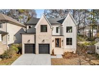 Stunning two-story home with a brick facade and a two-car garage at 2675 S Bamby Ne Ln, Brookhaven, GA 30319