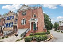 Brick front exterior of a charming townhome with landscaping at 3136 Mercer University Dr # 6, Chamblee, GA 30341
