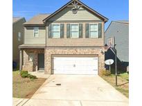 Two-story house with a white garage door and basketball hoop at 252 Magnaview Dr, Mcdonough, GA 30253